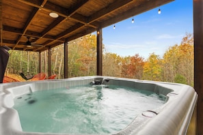 Relax in the hot tub looking at the mountain view and the stars