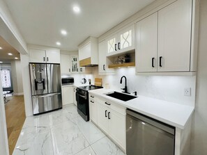 Dishwasher, refrigerator, cooking range and crockery