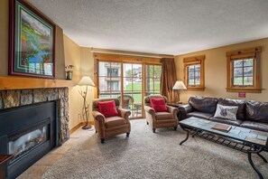 Fireplace, chairs, sliding glass door