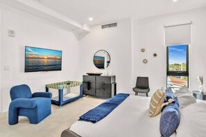 Relaxing bedroom with oceanfront balcony for a peaceful retreat.