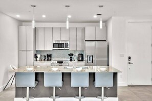 Spacious dining room with ample seating and storage for entertaining.