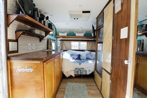 Overview - Kitchen to the left. Bathroom, closet, refrigerator & micro to right