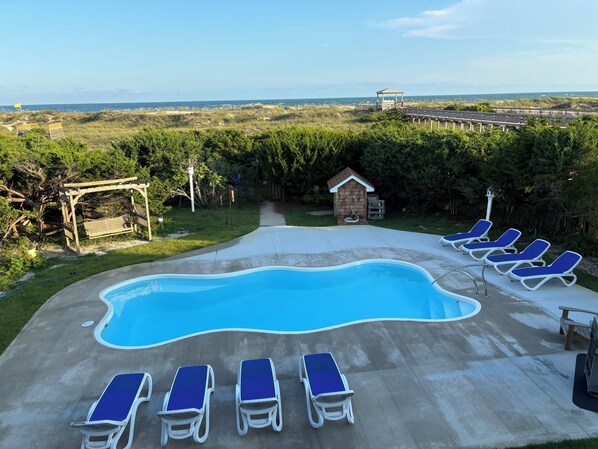 Backyard w/pool, 8 lounge chairs, foot washing station, private gate to beach.