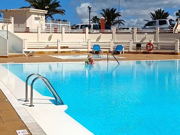 Large communal swimming pool for guests to enjoy