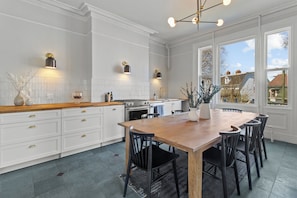 Our kitchen comes with everything you need, including paper towels, wine glasses, and cooking essentials.