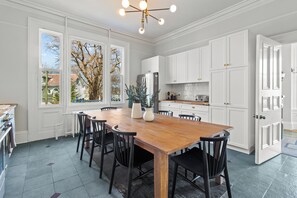 Cook and dine in style in our gourmet kitchen, equipped with modern appliances and a spacious dining area perfect for family meals and gatherings.