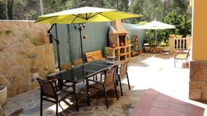 Full size BBQ and a dining area for up to 10 people.