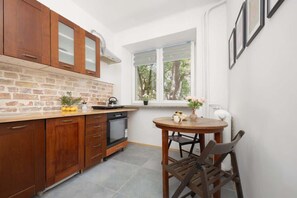 Separate kitchen with dining area.
