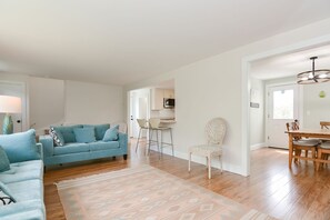 The living room is open to the kitchen and dining rooms.