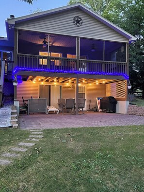 Night time view from the backyard with decorative lights.