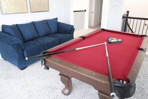 Game Room w Pool Table: A cozy game room with a pool table, perfect for family fun and entertainment during long-term insurance stays. After grabbing groceries from Walmart or Sprouts, enjoy a relaxing night in this spacious and family-friendly area.
