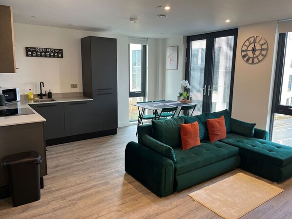 Living room, dining area and kitchen