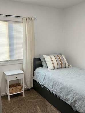 Twin bed with a pull out twin trundle