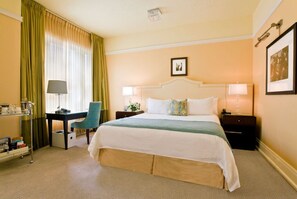 Spacious queen room designed for relaxation, featuring contemporary furnishings and a serene atmosphere.