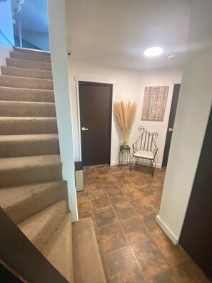 Main floor entrance with stairway to upstairs