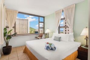 Relax in your bedroom with a king-size bed, and beautiful views of the city, mountain, and partial ocean views.