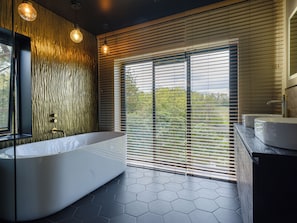 Main bathroom with shower, bath, his and her sinks