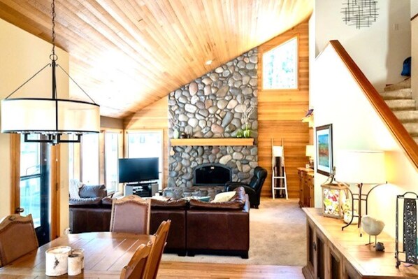 Living/Dining Room with River Rock Fireplace - Wood Provided