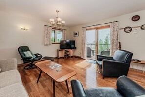 Open-concept family and dining space perfect for shared meals, games, and making memories with loved ones during your Bruce Peninsula stay.