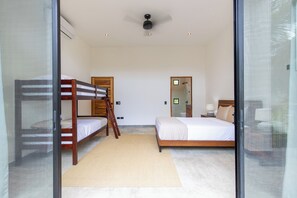 Bedroom 2 with queen bed and single bunk beds