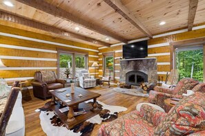 Family gathering - main level living room with wood burning fireplace