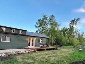 French doors leading out to new 10x32' deck overlooking the small stream 