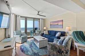 Let in the sun rays as you relax in the comfort of this living room with a view.
