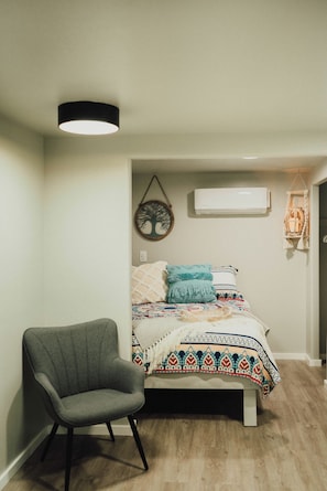 Fresh linens on a cozy queen bed. Mini Split Ductless System provides just the right room temp. 