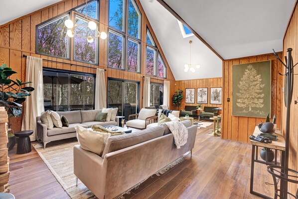 Welcome to our open living room with cathedral ceilings and a gorgeous view to boot.