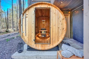 Cedar barrel sauna looking out into the enchanting forest scape.  Time to sweat!