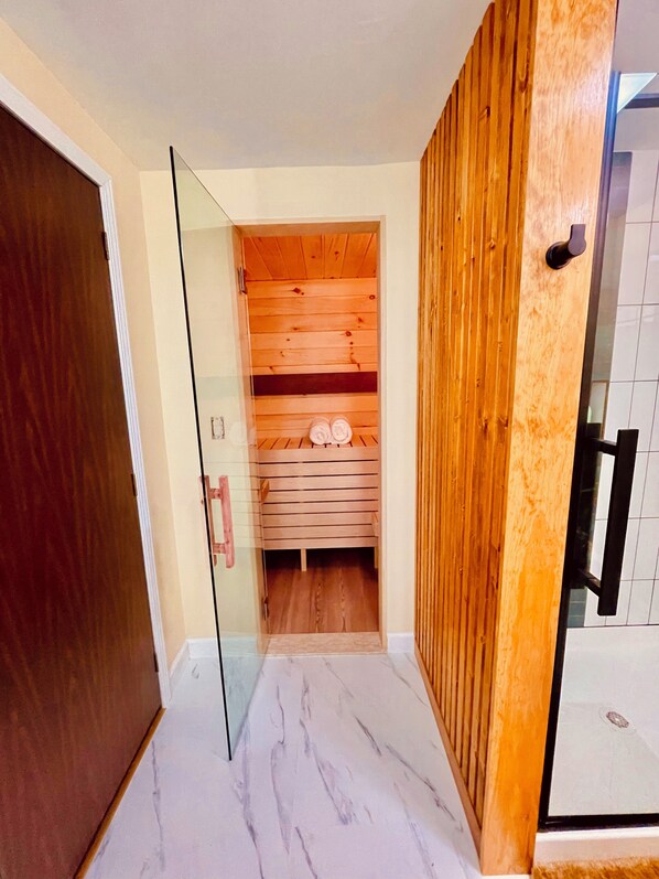 Private indoor electric sauna attached to bathroom. 