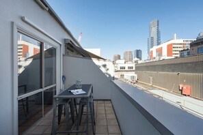 A seating area out on the balcony allows you to sip your morning coffee outside, taking in the views.
