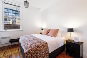 Sleep easy within the king-sized bed. It comes set with side tables and reading lights.
