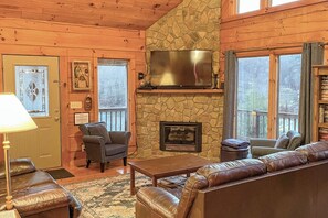 Gather in this cozy living room for movie nights, fireside chats, and a view.
