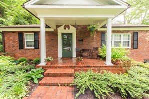 Stairs lead to back of property