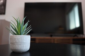 This white vase plant brings nature indoors, perfect for brightening up any room