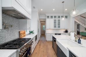 Gourmet kitchen with stainless steel appliances and gas range