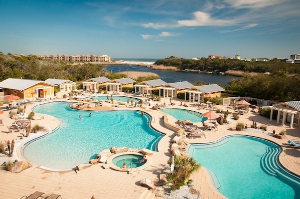 4 pools (1 heated in winter), 2 hot tubs, firepit and gas grills