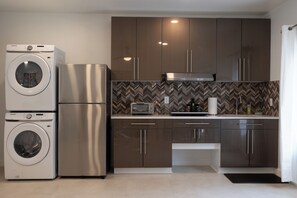 A full-sized refrigerator and freezer - Samsung washer/dryer for your use