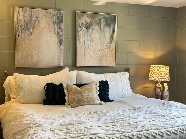 Relax in a king sized bed with top quality mattress and bedding!