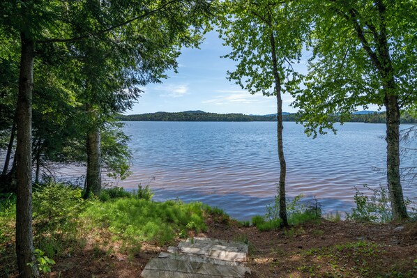 View from the house toward the lake and sandy-bottomed swimming area.