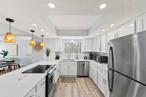 Freshly redone kitchen with Bar to hang around and socialize