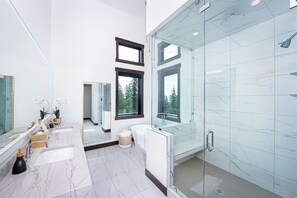 The spa-like master ensuite features heated floor, steam shower & soaker tub.