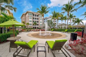 Splash pad and lounge area near pool just steps from unit- available for short term stay guests