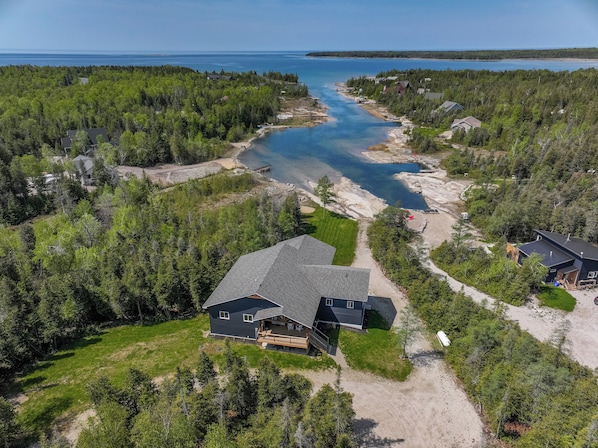 A view of the waterway leading out to the open water, perfect for exploring by kayak or paddleboard.