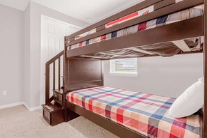 Cozy bunk bed setup perfect for kids or friends, featuring vibrant bedding and natural light.