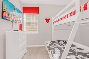 Delight in this charming themed bedroom with cozy bunk beds and fun decor, perfect for a family getaway.