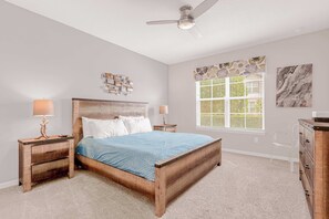 Relax in this cozy bedroom with a plush king-sized bed, stylish decor, and ample natural light.