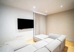 The large sofa ensures there's a spot for everyone during movie night!