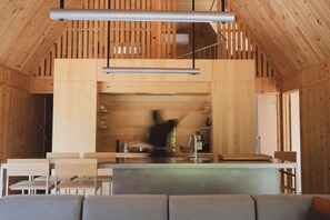 Open-concept kitchen, filled with natural light and fully equipped.